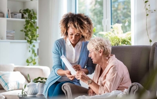 Home nurse taking care of a senior women