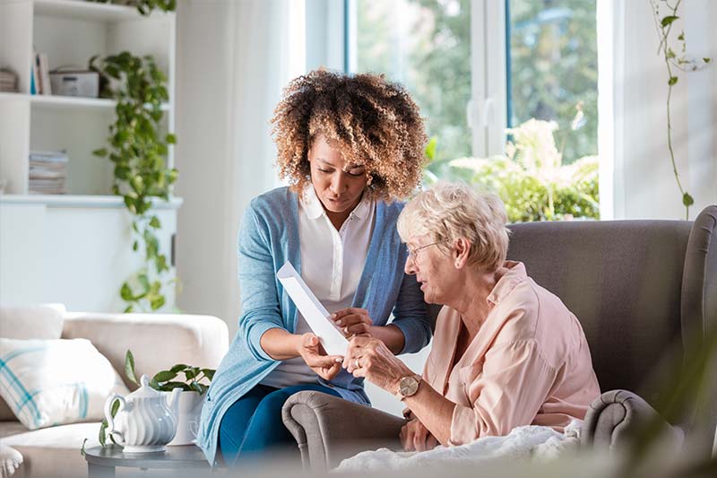 Home nurse taking care of a senior women