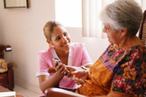 Health Aide Helps Elderly Woman