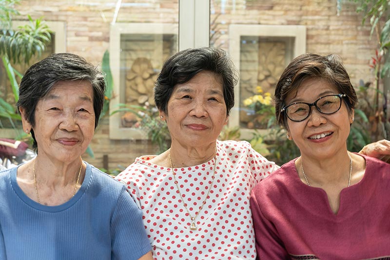 happy well-being ageing senior adult women sisters