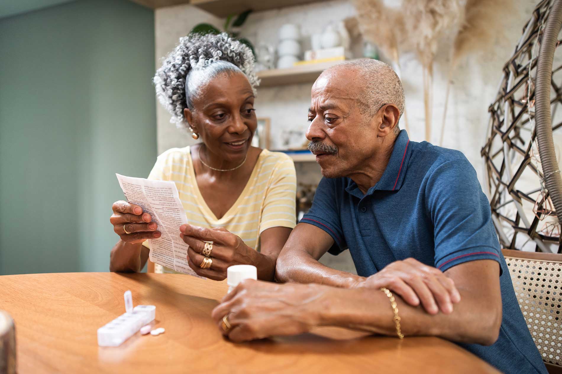 senior couple discussing care at home from harp medicaid program